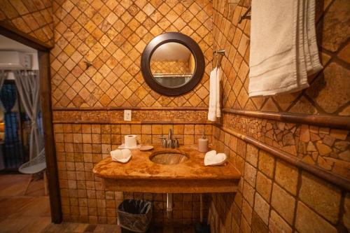 a bathroom with a sink and a mirror at Large family house in Cabo , pet friendly in Cabo San Lucas