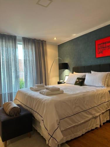 Ένα ή περισσότερα κρεβάτια σε δωμάτιο στο Quarto estilo loft