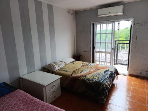 Ένα ή περισσότερα κρεβάτια σε δωμάτιο στο Complejo Berazategui 24