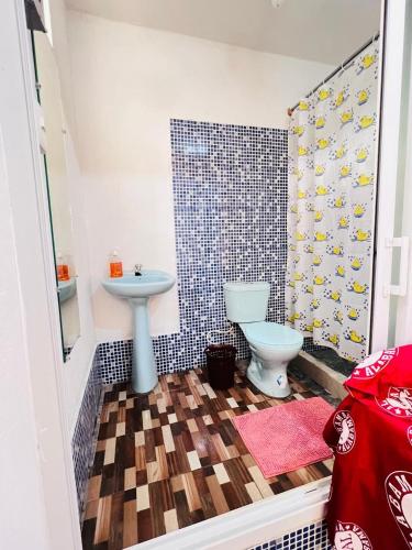 a bathroom with a sink and a toilet at Hotel Julián Cotuc in San Juan La Laguna