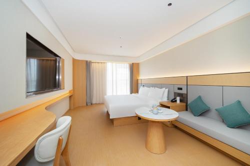 Ένα ή περισσότερα κρεβάτια σε δωμάτιο στο JI Hotel Nanjing Jiangning Jiaotong University Subway Station