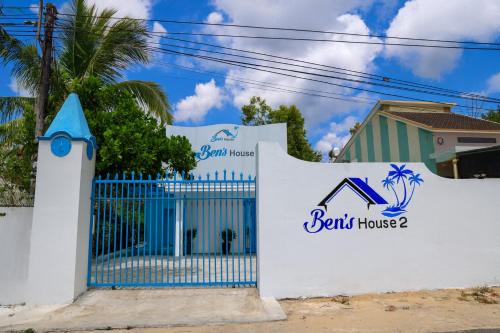 a gate in front of a house with a sign that reads built house at Ben's House 2 in Tam Ky