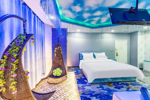 Ένα ή περισσότερα κρεβάτια σε δωμάτιο στο Star Dream Hotel