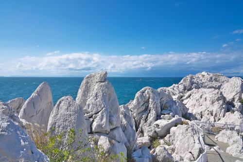 a group of large rocks on the beach at Yura terrace in Yura