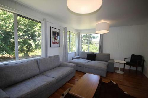 a living room with a couch and a table at Carawatha in Blackheath