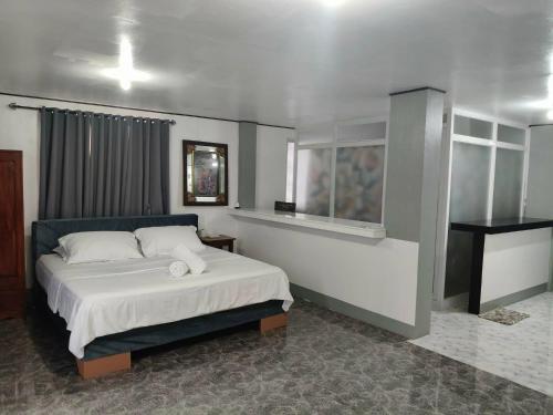 Ένα ή περισσότερα κρεβάτια σε δωμάτιο στο Mope Beach Resort