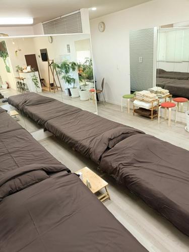 a room with several beds sitting on the floor at Your Bedroom Hakone in Odawara