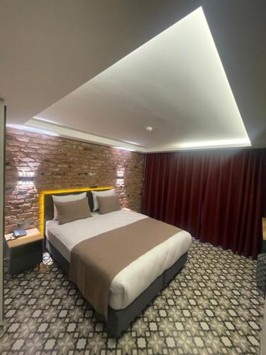 Postel nebo postele na pokoji v ubytování Artelist Hotel