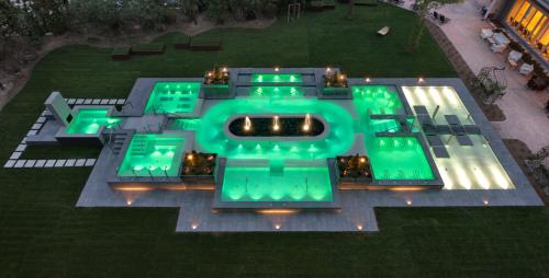 an aerial view of a building with green lights at Hotel Mioni Pezzato in Abano Terme