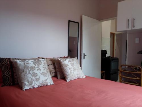 Ένα ή περισσότερα κρεβάτια σε δωμάτιο στο Port Elizabeth Apartment