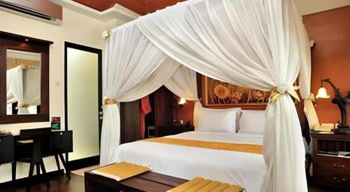 Ένα ή περισσότερα κρεβάτια σε δωμάτιο στο Savali Hotel