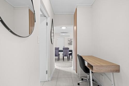 a hallway with a table and chairs and a mirror at 356 Ballito Hills in Ballito