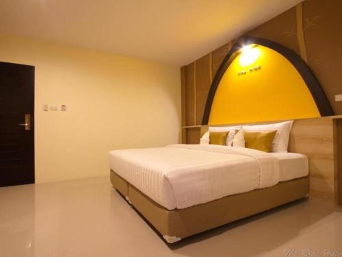 Кровать или кровати в номере The Rice Hotel