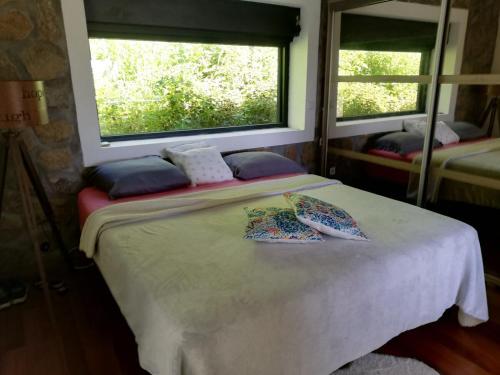 En eller flere senge i et værelse på L'enclos Pandora à SAINTE ROSE