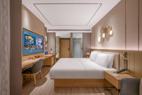 Postel nebo postele na pokoji v ubytování Orange Hotel Chengdu Shuangliu International Airport