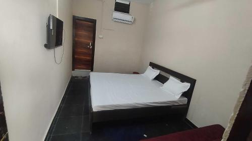 Postel nebo postele na pokoji v ubytování HOTEL O RASRANG