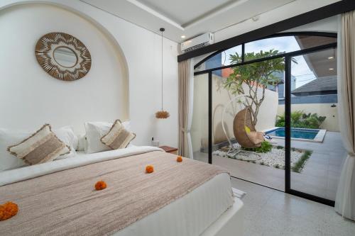 Ένα ή περισσότερα κρεβάτια σε δωμάτιο στο 3Bedrooms Escape Villa Legian Near Doublesix Beach