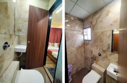 un bagno con un lavandino e una doccia di Hotel Shiv Shakti a Rajkot