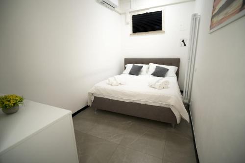 Ένα ή περισσότερα κρεβάτια σε δωμάτιο στο Teodorico 21 Center & Comfort