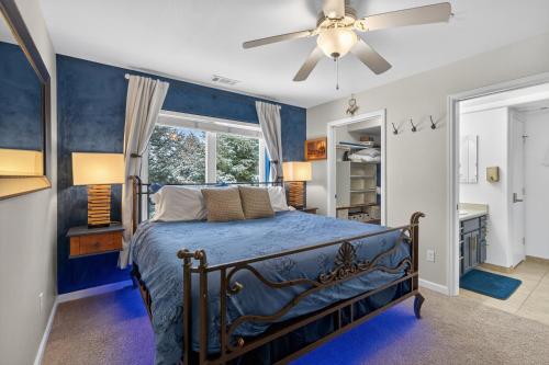 a bedroom with a bed and a ceiling fan at New Castles Kings N Queens 14mins to Glenwood Springs in New Castle