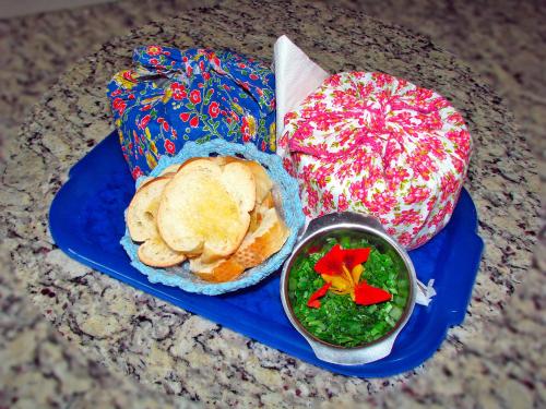 a blue tray with a plate of food on a table at Pousada Kafundó - Inhotim in Brumadinho