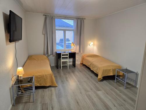 En eller flere senge i et værelse på Ilona 2 Vanha Rauma