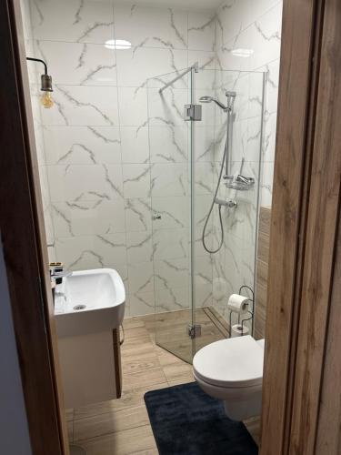 Ванная комната в Urocze Apartamenty LOFT przy Molo