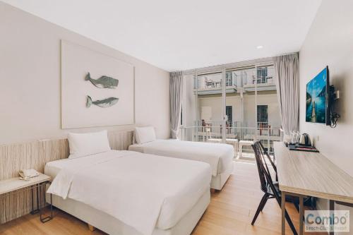 Postel nebo postele na pokoji v ubytování Combo Beach Hotel Samui