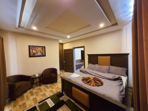 Giường trong phòng chung tại Qayam Hotel & Apartments