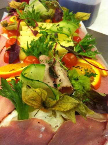 a plate of food with different types of vegetables at Tallhöjden Hotel & Cottage Lodge in Simlångsdalen