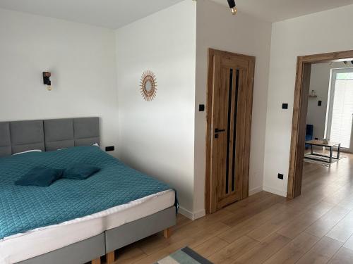 Кровать или кровати в номере Urocze Apartamenty LOFT przy Molo