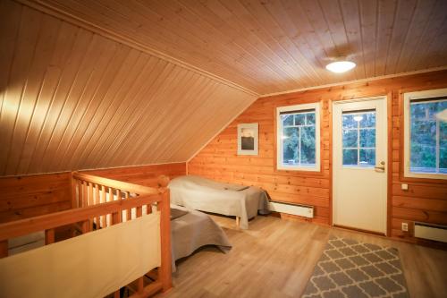 Ένα ή περισσότερα κρεβάτια σε δωμάτιο στο Iisland Uoma Lovely house and sauna by the river