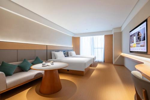 En eller flere senge i et værelse på JI Hotel Nanjing National Agricultural Innovation Center