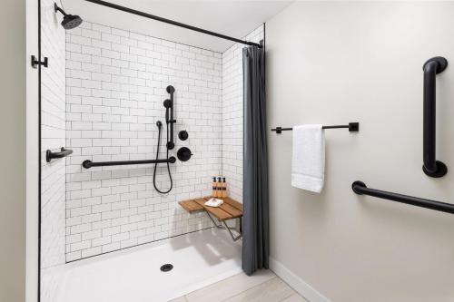 a bathroom with a shower with a glass door at Pell Hotel JdV by Hyatt in Middletown