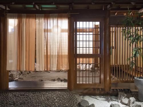 Ένα ή περισσότερα κρεβάτια σε δωμάτιο στο Hotel Shirakawa Yunokura