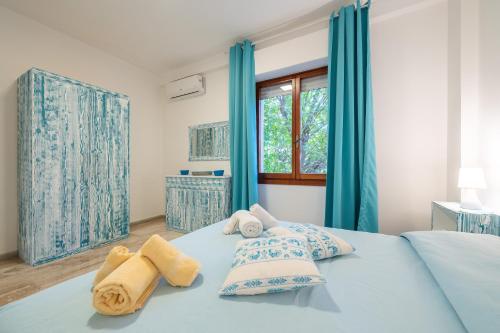 Ένα ή περισσότερα κρεβάτια σε δωμάτιο στο Appartamento Le Pavoncelle