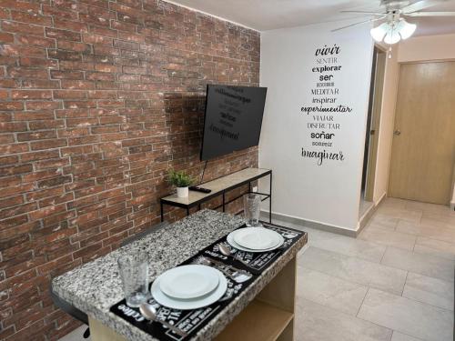 Телевизор и/или развлекательный центр в Departamento Ejecutivo de Lujo