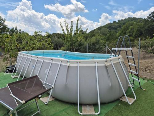 a large pool with a ladder next to a ladder at Masseria Marotta Appartamento in Santa Paolina