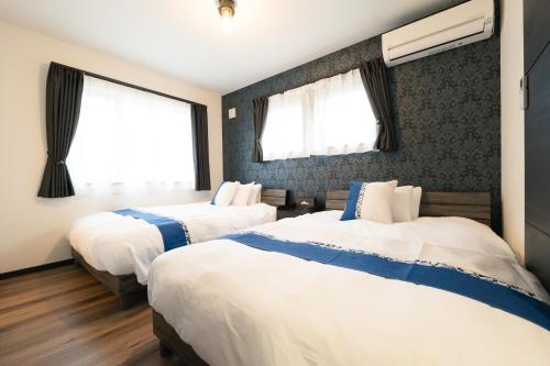 Guest House TEINE Nisimiyanosawa 41 一棟貸切 手稲スキー場へ好アクセス 全室床暖房 最大11名滞在 120型ホームシアター 無料駐車場2台完備 小樽まで車で25分 白い恋人パーク5分 天然温泉車で4分