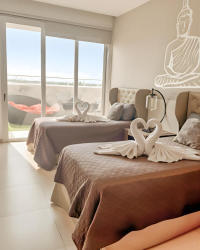 Ένα ή περισσότερα κρεβάτια σε δωμάτιο στο Casa Buddha - Pool, Jacuzzi and private terrace