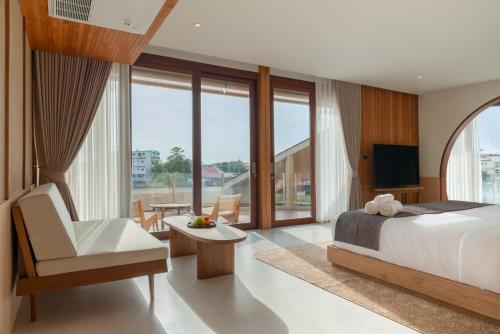 Ένα ή περισσότερα κρεβάτια σε δωμάτιο στο BAAT Boutique Hotel - บาตร บูทีคโฮเทล อยุธยา