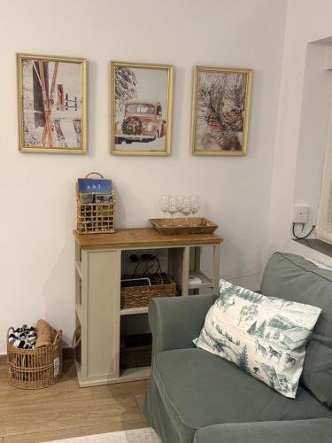 a living room with a table and a couch at Apartamento La Sabina in Reinosa