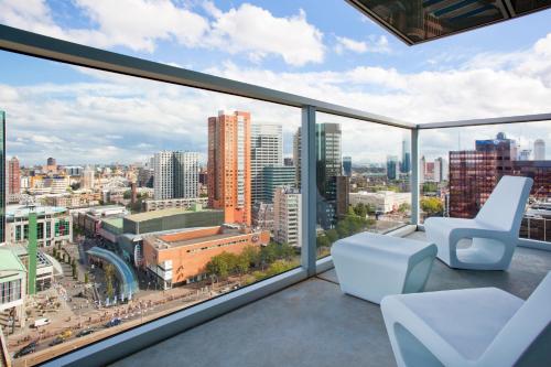 an office with a view of the city from a window at Urban Residences Rotterdam in Rotterdam