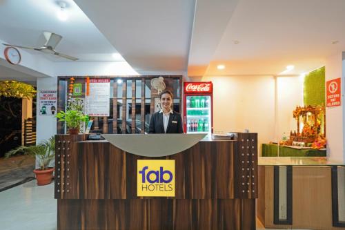 a lobby of a hotel with a reception desk at FabHotel Club Metro in Nagpur