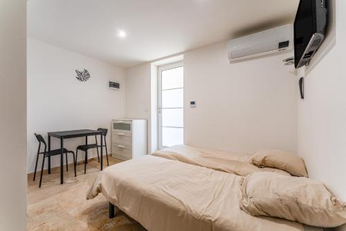 Ένα ή περισσότερα κρεβάτια σε δωμάτιο στο Canto Cigalo Rdc 2