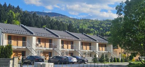 a building with solar panels on top of it at Kasztanowy Zakątek in Szczyrk