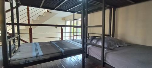 a room with two bunk beds and a staircase at 88 Ehome Noibai Airport in Hanoi