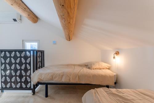 Giường trong phòng chung tại Canto Cigalo Duplex no 11