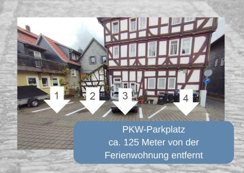 a picture of a building with arrows pointing to different buildings at Erdgeschosswohnung im historischen Fachwerkhaus in Alsfeld inklusive PKW-Parkplatz in Alsfeld