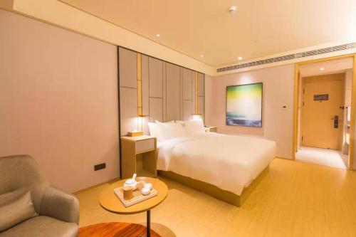 En eller flere senge i et værelse på JI Hotel Suzhou Shishan Binhe Road (formerly Xingyuewan Branch, High-tech Zone)